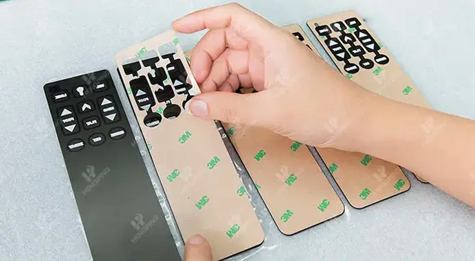 graphic overlays backing adhesive applying